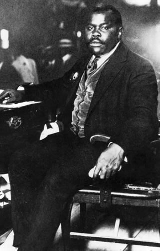 Marcus Garvey Sitting At Desk